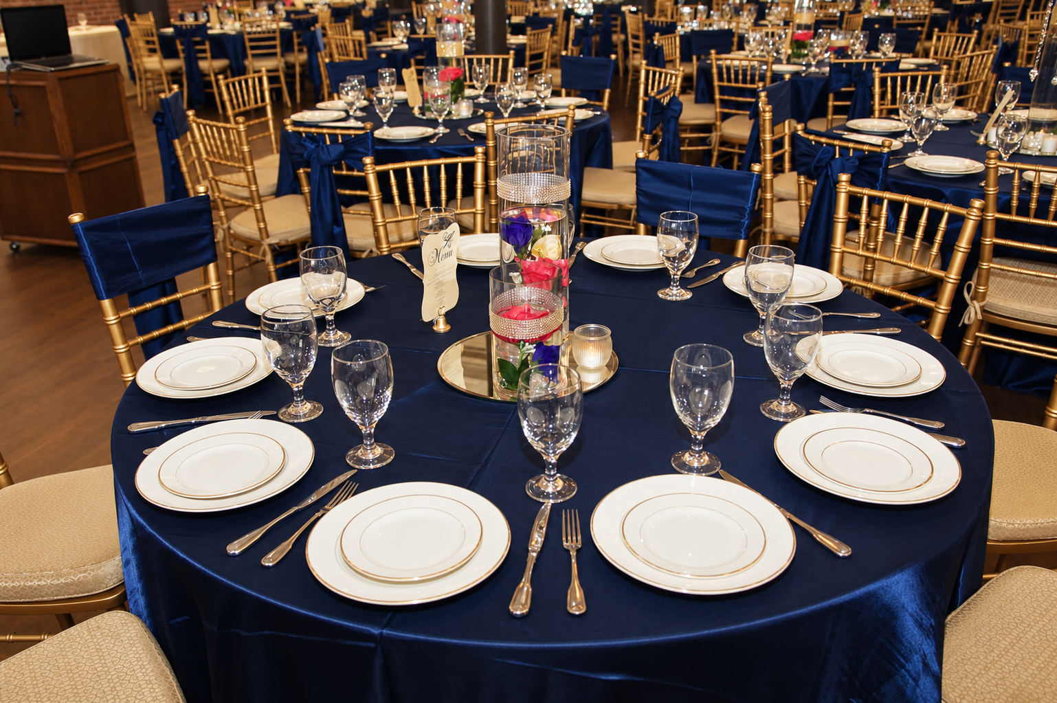 Navy tablescape with gold chairs